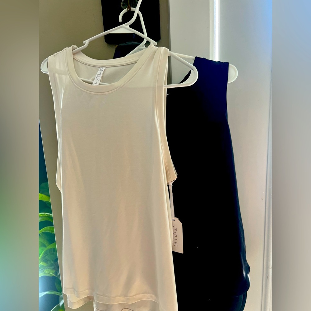 two a line tank tops, one black one white never worn size large ANA